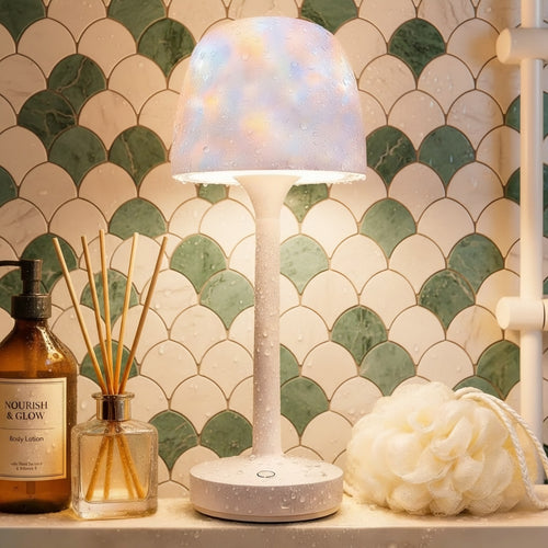 White shower lamp with water droplets on it, placed in a bathroom setting with toiletries.